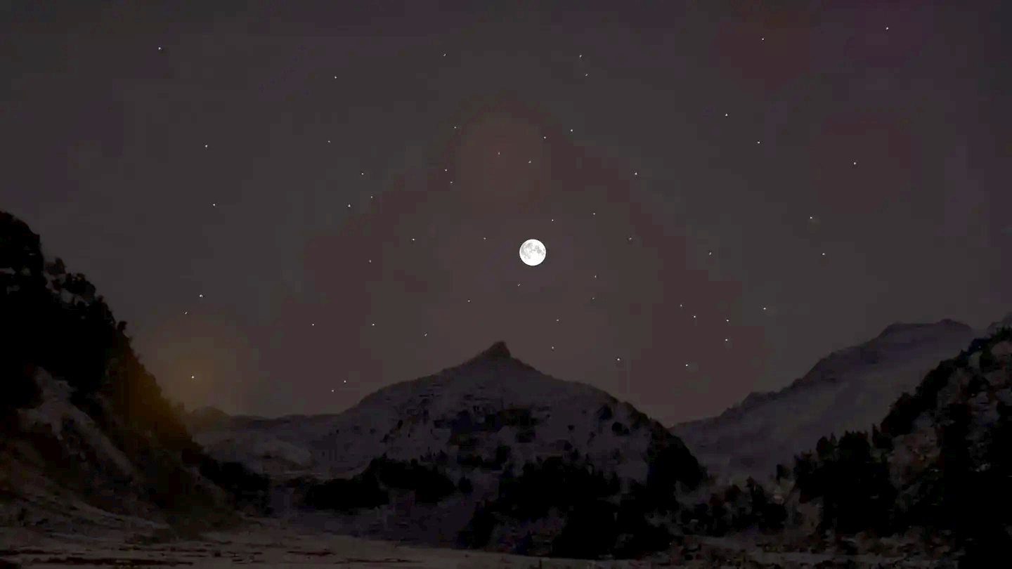 Full moon and stars over the snowy Aneto mountains at night